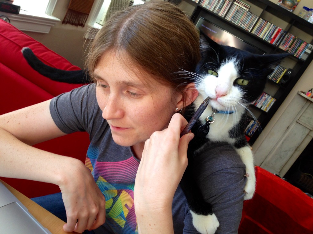 Loki helps Erin with her work.