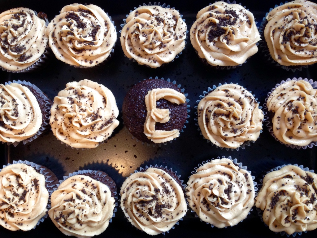 Serena and Stacy bake chocolate-peanut butter cupcakes for Erin.