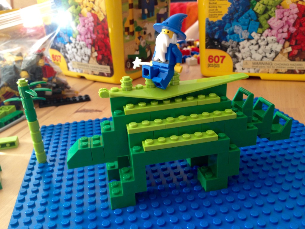 Serena builds a lego stegosaurus. (Legosaurus?)