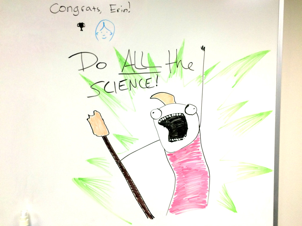 Erin decorates the whiteboard at work.